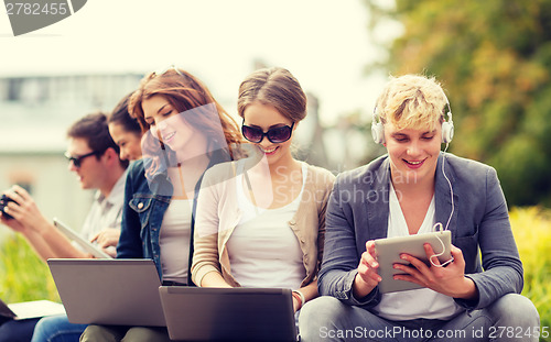 Image of students or teenagers with laptop computers