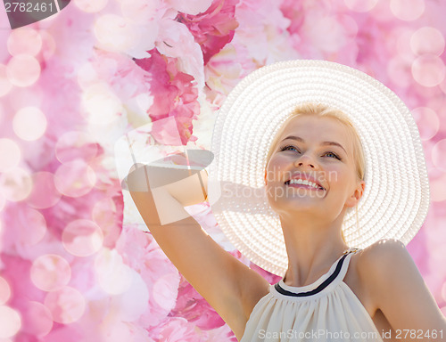 Image of beautiful woman enjoying summer outdoors