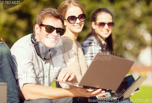 Image of students or teenagers with laptop computers