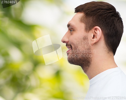 Image of portrait of smiling young handsome man