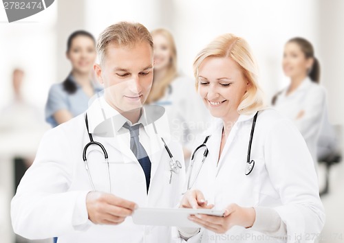 Image of two doctors looking at tablet pc