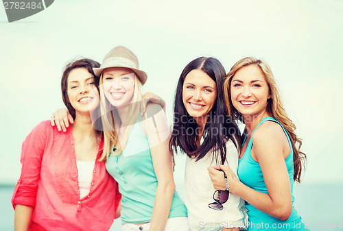 Image of group of girls chilling on the beach