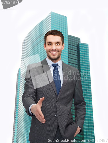 Image of businessman with open hand ready for handshake