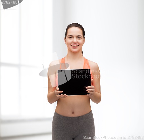 Image of sporty woman with tablet pc blank screen