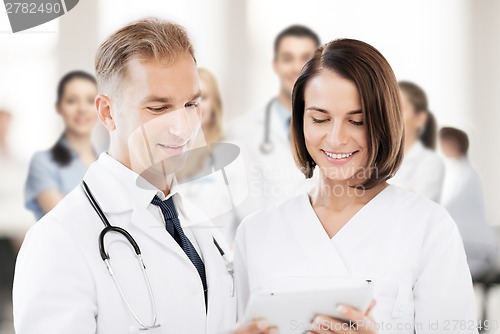 Image of two doctors looking at tablet pc