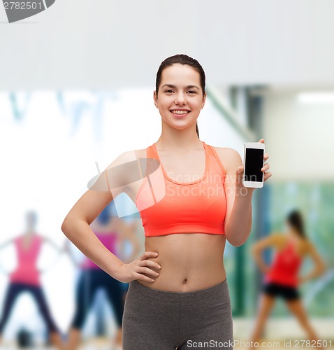 Image of sporty woman with smartphone