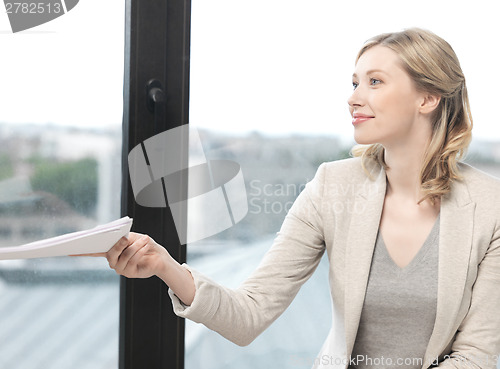 Image of happy woman with documents
