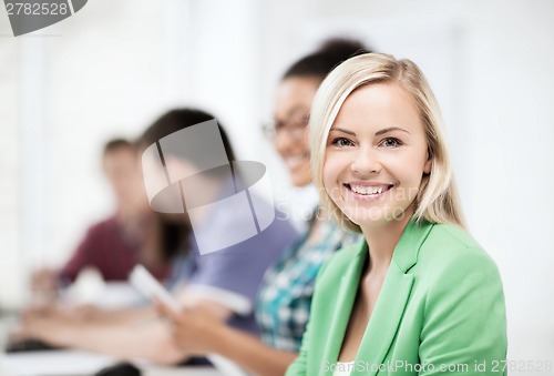 Image of students with computers studying at school