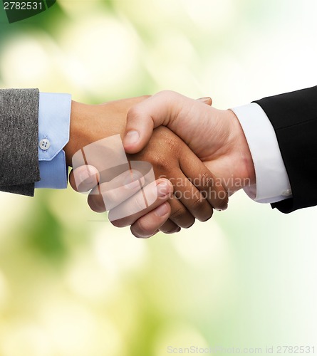 Image of businessman and businesswoman shaking hands