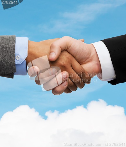 Image of businessman and businesswoman shaking hands