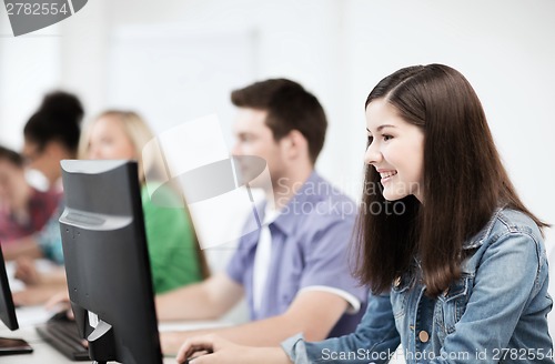 Image of students with computers studying at school