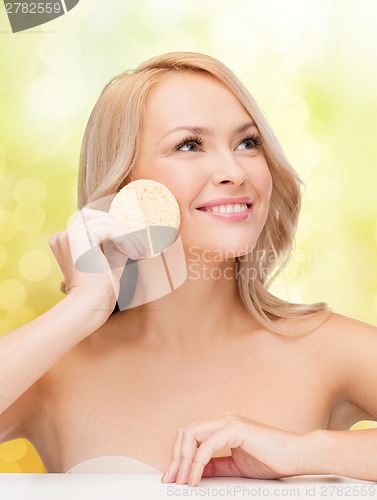 Image of beautiful woman with sponge