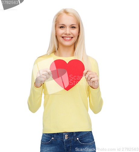 Image of smiling woman with red heart