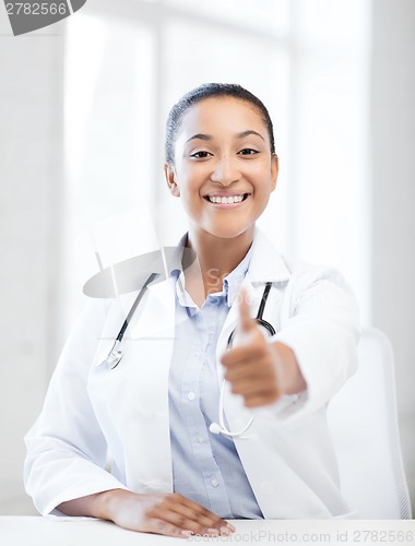 Image of doctor with stethoscope showing thumbs up