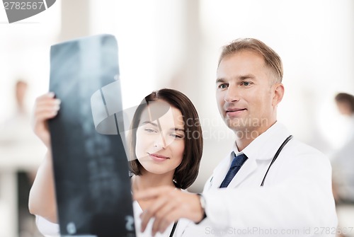 Image of two doctors looking at x-ray