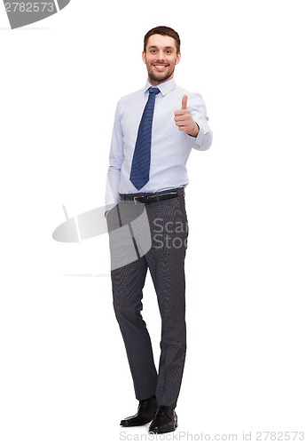 Image of handsome businessman showing thumbs up