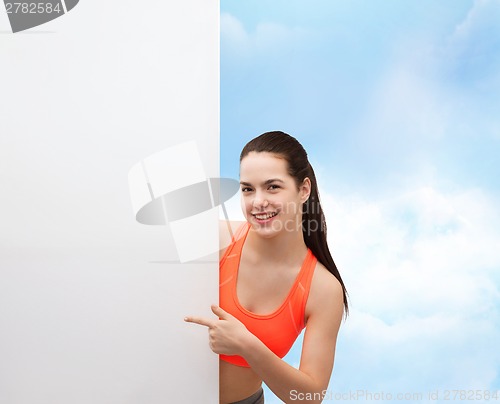 Image of teenage girl in sportswear with white board