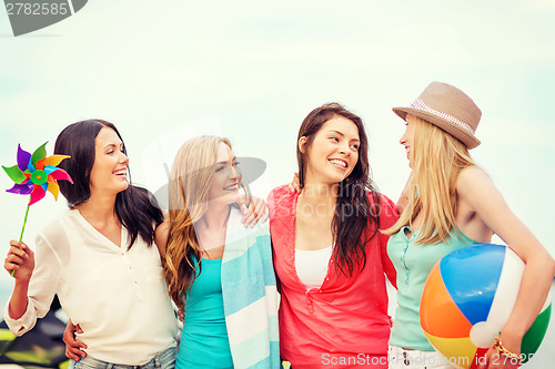 Image of girls with ball on the beach