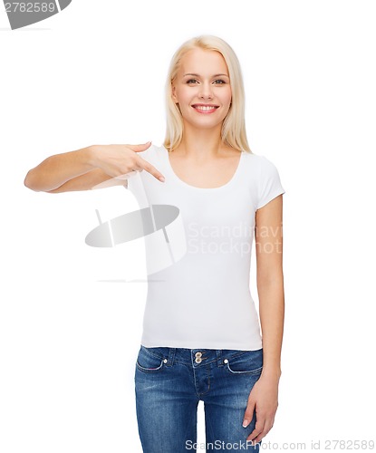 Image of smiling young woman in blank white t-shirt