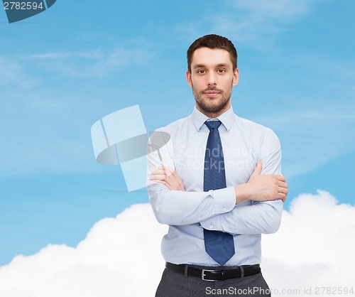 Image of handsome businessman with crossed arms