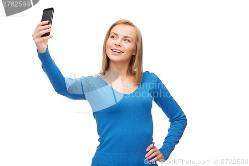 Image of woman taking self picture with smartphone camera