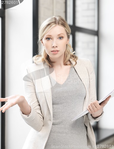 Image of worried woman with documents