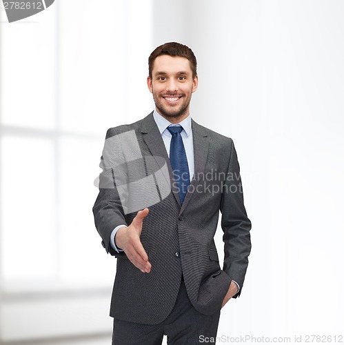 Image of businessman with open hand ready for handshake