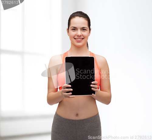 Image of sporty woman with tablet pc blank screen