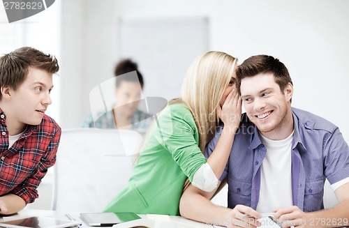 Image of group of students gossiping at school