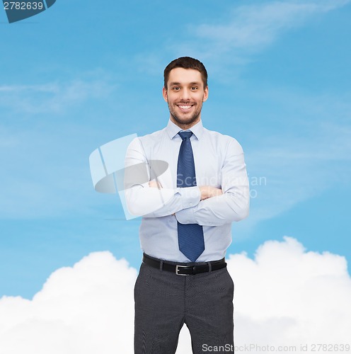 Image of handsome businessman with crossed arms