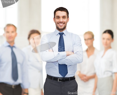 Image of handsome businessman with crossed arms