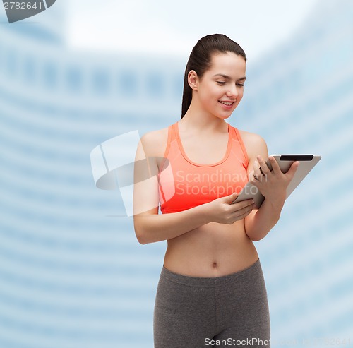 Image of sporty woman with tablet pc computer