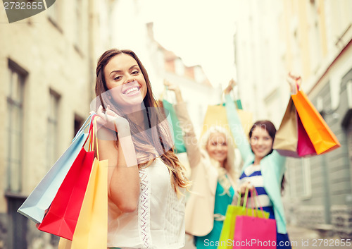 Image of beautiful woman with shopping bags in the ctiy