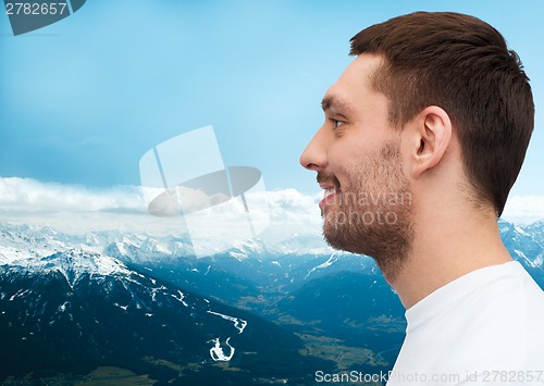 Image of portrait of smiling young handsome man