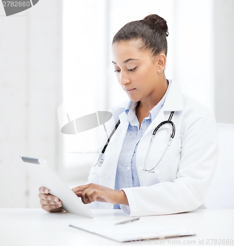 Image of african female doctor with tablet pc