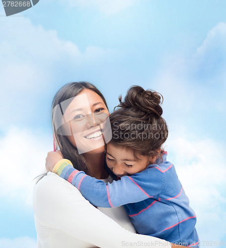 Image of hugging mother and daughter