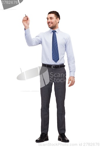 Image of attractive businessman or teacher with marker
