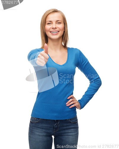 Image of smiling girl in casual clothes showing thumbs up