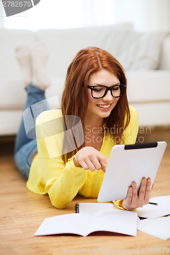 Image of student with tablet pc computer and notebooks