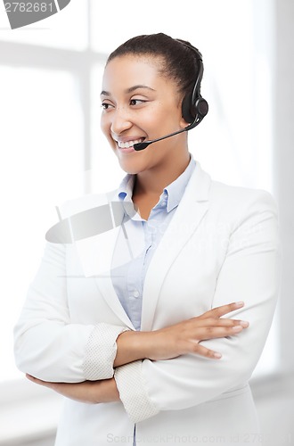 Image of african helpline operator with headphones