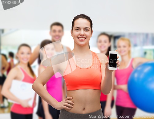 Image of sporty woman with smartphone