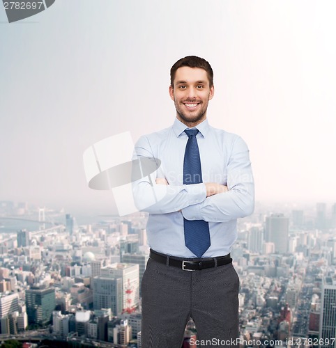 Image of handsome businessman with crossed arms