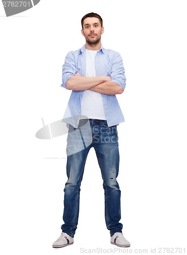 Image of calm man with crossed arms