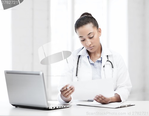 Image of female doctor with laptop pc