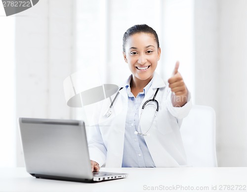 Image of female doctor with laptop pc