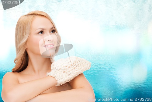 Image of smiling woman with exfoliation glove