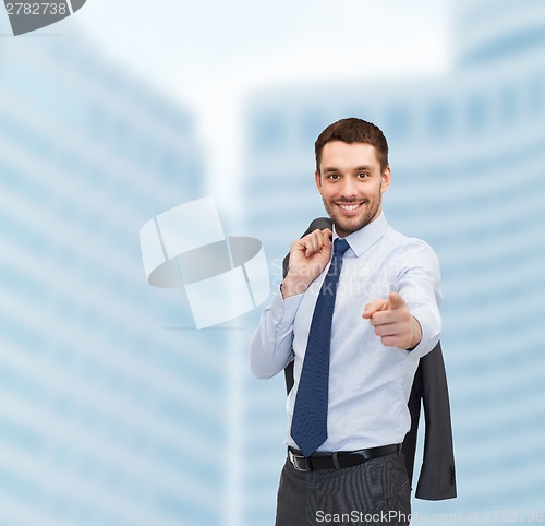 Image of handsome buisnessman with jacket over shoulder