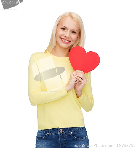 Image of smiling woman with red heart