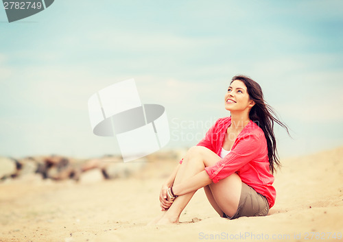 Image of girl sitting on the beach