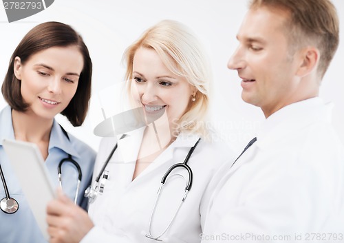 Image of doctors looking at tablet pc